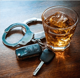 Handcuffs next to an alcoholic drink and a set of car keys